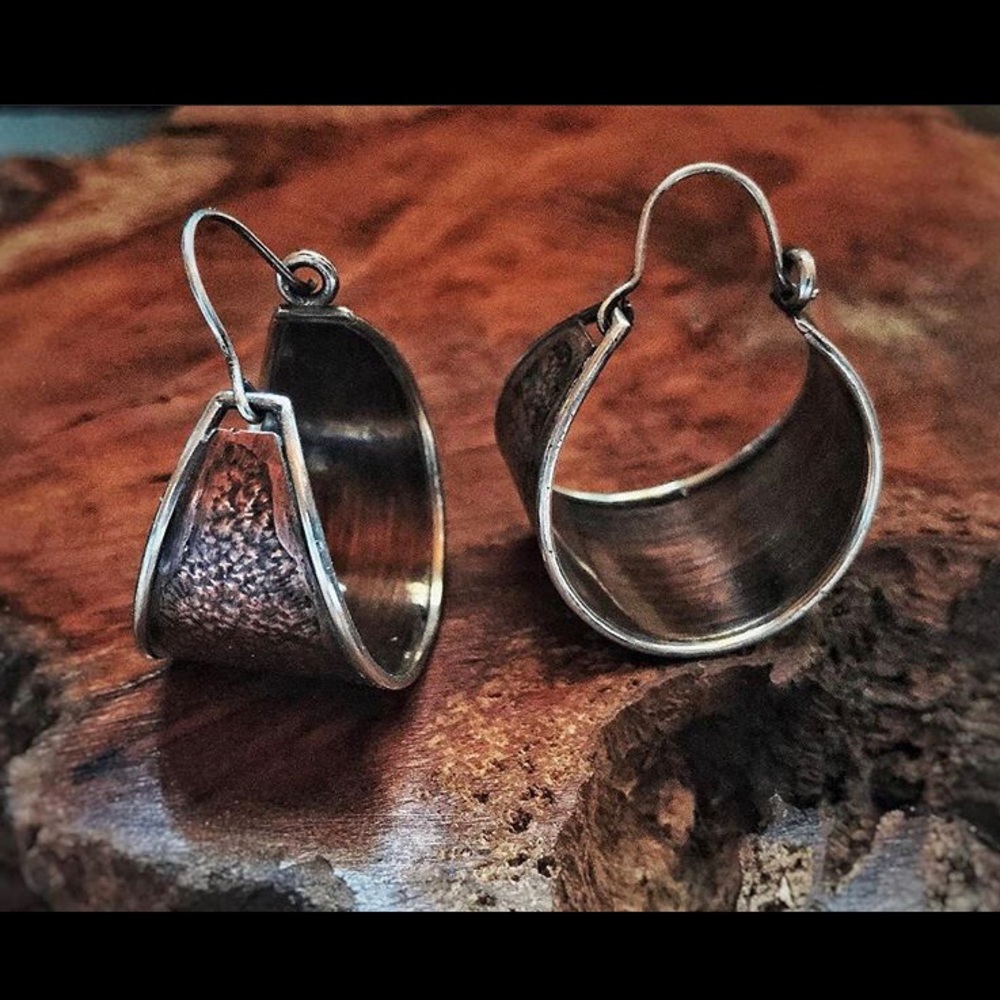 Brushed copper and silver hoops.